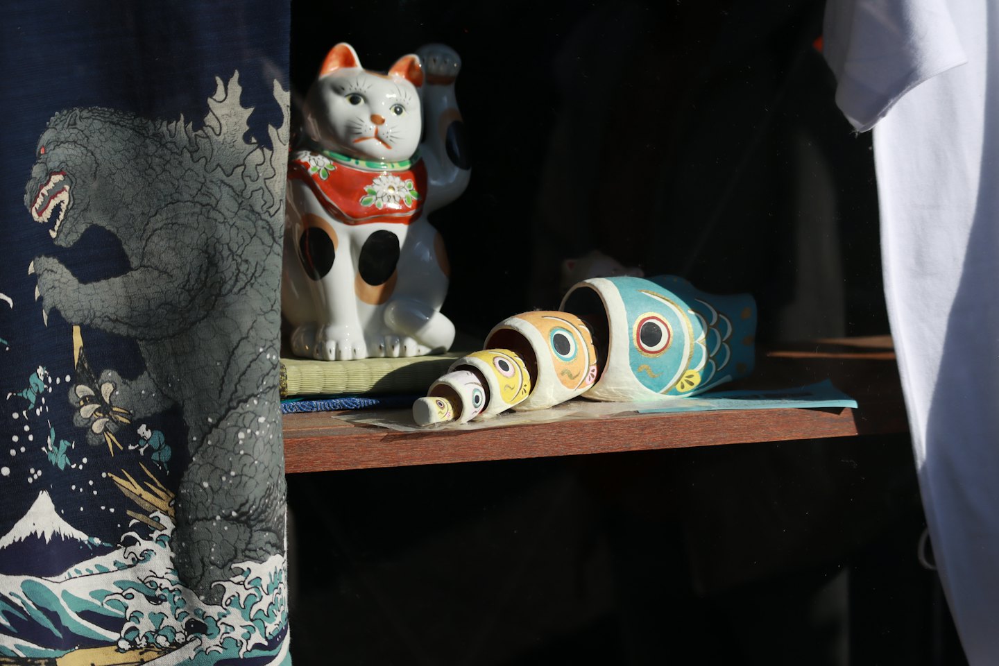 Japanese items displayed on a shop shelf.